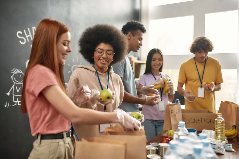 people packing food donation boxes